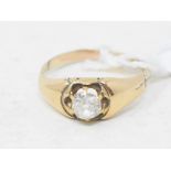 A diamond solitaire ring, in a yellow coloured metal mount, approx. ring size M½ Report by NG The