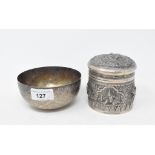 An Indian silver coloured metal box and cover, embossed flowers and foliage, 9.5 cm high, and a