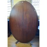 A mahogany oval dining table, on splay legs, 177 cm wide