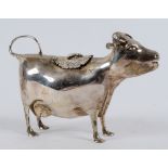 An 18th century Dutch style silver cow creamer, the hinged lid applied a bee, Garrards, London 1969,