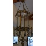 A large brass hall lantern, the shade of circular form with clear bevelled glass panels, on rope