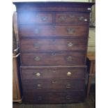 A 19th century oak chest on chest, the moulded cornice above two short and three graduated long