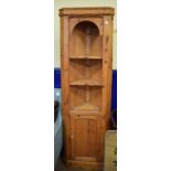 A pine floor standing corner cupboard, 56 cm wide, a coffee table, a small chest of drawers, chairs,