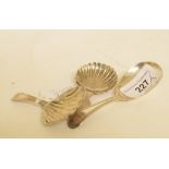 An early 19th century silver caddy spoon, initialled, with bright cut decoration and a shell bowl,
