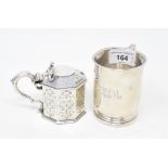 A Victorian silver octagonal mustard pot, crested, with engraved decoration, London 1847, and a