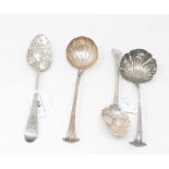 A pair of mid-18th century silver berry spoons, marks indistinct, and two mid-18th century ladles,