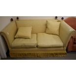 A two seater Knole style settee, with gold floral upholstery