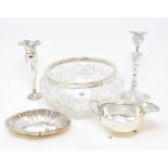 A silver sauce boat, Birmingham 1944, a silver coloured metal dish, a silver candlestick, a silver