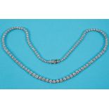 An 18ct white gold necklace, set graduated diamonds, with an approx. weight of 7.5ct See back