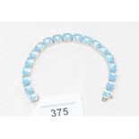 A silver and blue topaz line bracelet Modern