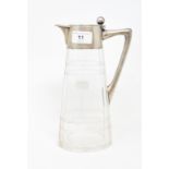 A Continental glass and silver coloured metal mounted claret jug, stamped .800, 25.5 cm high