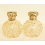 A large pair of Victorian silver mounted cut glass scent bottles, monogrammed, London 1897, 12.5