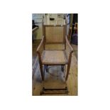 An beech invalid chair, with canework seat and back