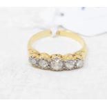 An 18ct gold and five stone diamond ring, approx. ring size N Report by GH Gross weight approx. 1.