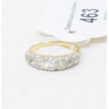 A seven stone diamond half hoop ring, in a yellow coloured metal mount, apparently unmarked, approx.