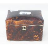 A tortoiseshell tea caddy, of shaped rectangular form, 12.5 cm wide