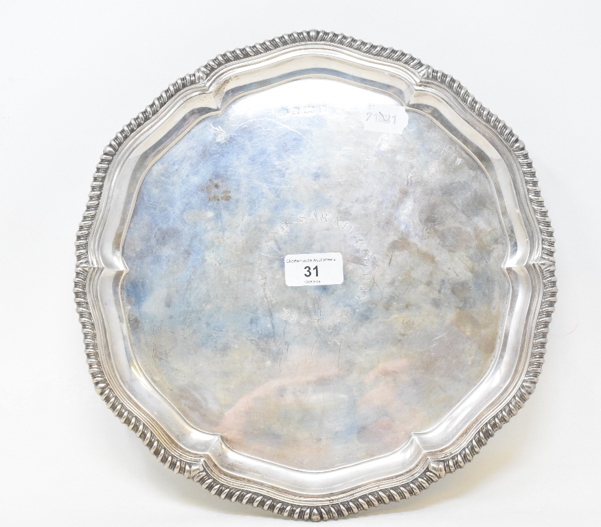 An 18th century style silver salver, inscribed and dated '56, on three scroll feet, Elkington,