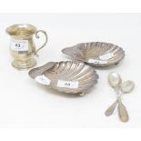 A silver shell butter dish, Sheffield 1906, another similar, a christening mug, and two spoons,