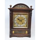 An Edwardian mantel clock, the 17 cm square brass dial signed J W Benson, Ludgate Hill, London, with