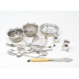 Two Indian silver coloured metal bowls, with embossed landscape decoration, a silver cigarette case,