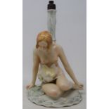 A Carl Ens porcelain table lamp, in the form of a nude lady sitting on a lily pad, slight loss, 22