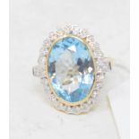 A 9ct gold, blue topaz and diamond ring, approx. ring size M Modern