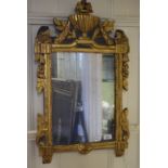 A Continental giltwood wall mirror, surmounted an urn and with floral swags, 42 cm wide Report by GH