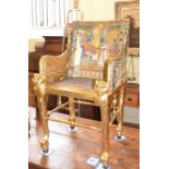 An Egyptian style armchair, with gilt decoration