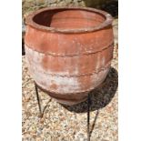 A garden terracotta amphora, on a metal stand, 58 cm diameter