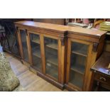 An oak breakfront bookcase, with adjustable shelves, 183.5 cm wide