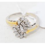 A yellow gold and marquise diamond fancy ring