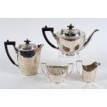 A silver four piece tea and coffee service, Sheffield 1928/29, approx. 38.8 ozt, and a pair of