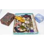 Assorted medallions, a Japanese knife, with a bone handle, a box, applied seals, a teddy bear, and