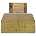 An early 19th century brass mounted travelling trunk, with studwork decoration, the interior applied