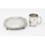 A silver waiter, on four scroll feet, Chester 1930, and a silver christening mug, inscribed and