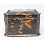 An early Victorian tea caddy, veneered in tortoiseshell, some loss/damage, top detached, 19 cm wide