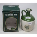 A bottle of Tullamore Dew whiskey, in a ceramic bottle, with original carton