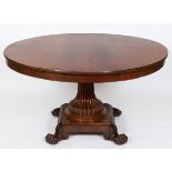 A 19th century walnut centre table, on a reeded column, and a square platform base with four paw