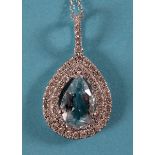 An 18ct white gold, aquamarine and diamond pendant, on a chain See illustration