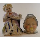 A porcelain tobacco box, in the form of a lady drinking tea, 22 cm high and another (2) Modern