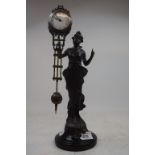 A mystery timepiece, in the form of a lady, 33 cm high Modern