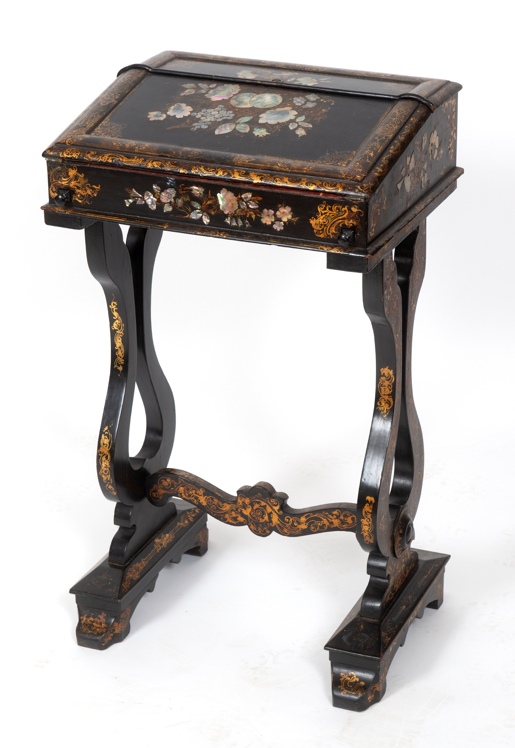 A Victorian papier mache lady's writing desk, with gilt and mother of pearl inlaid floral and