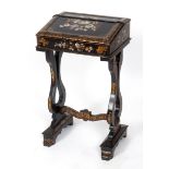 A Victorian papier mache lady's writing desk, with gilt and mother of pearl inlaid floral and