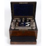 A Victorian dressing case, veneered in burr walnut, the glass fittings with silver plated mounts, 31