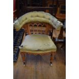 A pair of Victorian oak Gothic revival armchairs, in need of restoration Report by GH The chair with