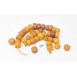 A string of amber type beads, 59 cm