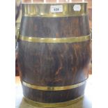 An oval oak bucket, bound in brass, 38 cm high