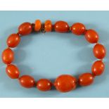 An amber bead necklace, with fifteen graduated beads See illustration Report by RB The largest