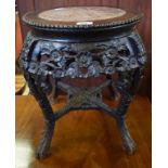 A Chinese hardwood jardiniere stand, with a marble inset top, carved flowers and foliage, 48 cm