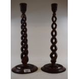 A pair of carved wood spiral twist candlesticks, 41 cm high (2) Modern